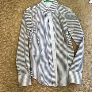 Woman’s blue and white striped blouse.